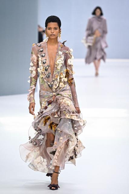 A model presents a creation for Zimmermann Women's Spring/Summer 2027 collection fashion show as part of the Paris Fashion Week, in Paris on October 5, 2026. (Photo by JULIEN DE ROSA / AFP)