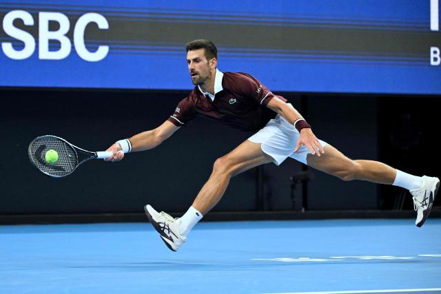 Serbia’s Novak Djokovic hits a return to Russia’s Daniil Medvedev during their men’s singles semi-final at the China Open tennis tournament in Beijing on October 5, 2026. (Photo by Greg Baker / AFP)