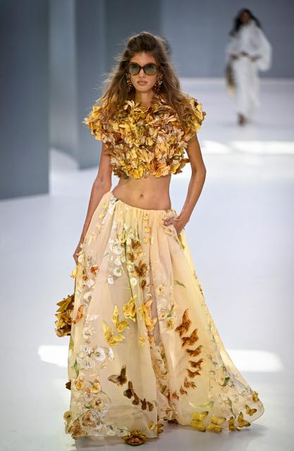 A model presents a creation for Zimmermann Women's Spring/Summer 2027 collection fashion show as part of the Paris Fashion Week, in Paris on October 5, 2026. (Photo by JULIEN DE ROSA / AFP)