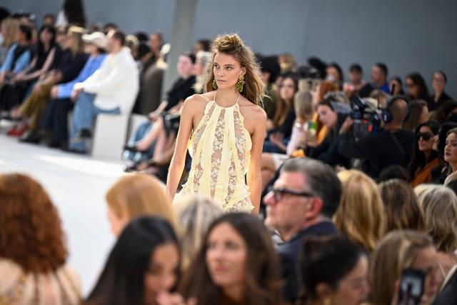 A model presents a creation for Zimmermann Women's Spring/Summer 2027 collection fashion show as part of the Paris Fashion Week, in Paris on October 5, 2026. (Photo by JULIEN DE ROSA / AFP)