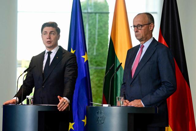 German Chancellor Friedrich Merz (R) and Lithuania's Prime Minister Mindaugas Sinkevicius deliver a joint press conference after talks at the Chancellery in Berlin on October 5, 2026. (Photo by John MACDOUGALL / AFP)