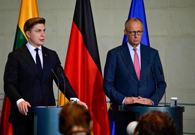 German Chancellor Friedrich Merz (R) and Lithuania's Prime Minister Mindaugas Sinkevicius deliver a joint press conference after talks at the Chancellery in Berlin on October 5, 2026. (Photo by John MACDOUGALL / AFP)