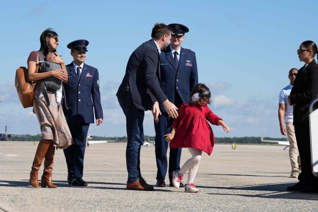 US Vice President JD Vance and his wife Usha Vance (L) and their family board Air Force Two at Joint Base Andrews in Maryland, October 5, 2026. Vance is travelling to attend a campaign rally ahead of the midterm elections, in Fairbanks, Alaska. (Photo by Jacquelyn Martin / POOL / AFP)