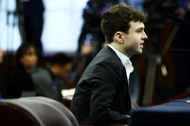 AI researcher Jacob Coxon testifies at a city council hearing in New York on October 5, 2026. Coxon previously worked for Open AI and Anthropic has warned that AI labs were "gambling with our lives". (Photo by CHARLY TRIBALLEAU / AFP)