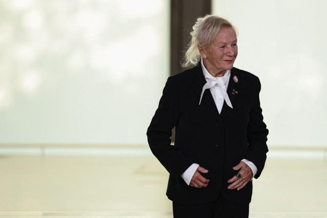 French designer Agnes Trouble known as Agnes b. aknowledges the audience at the end of the Agnes b. Women's Spring/Summer 2027 collection fashion show as part of the Paris Fashion Week, in Paris on October 5, 2026. (Photo by SIMON WOHLFAHRT / AFP)