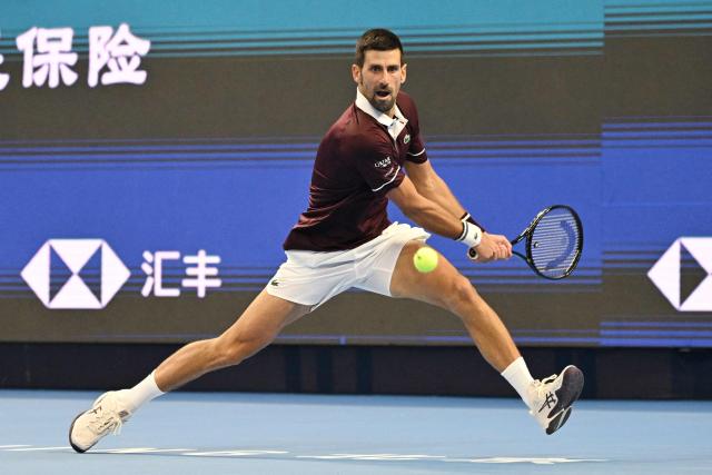 Serbia’s Novak Djokovic hits a return to Russia’s Daniil Medvedev during their men’s singles semi-final tennis match at the China Open tennis tournament in Beijing on October 5, 2026. (Photo by GREG BAKER / AFP)