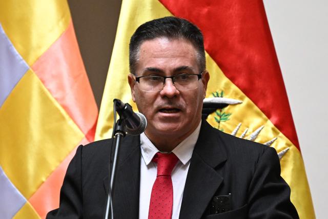 Jose Armando Urioste speaks during a ceremony recognizing his appointment as Bolivia's interim attorney general at the Government Palace in La Paz on October 5, 2026. The Bolivian Congress suspended the attorney general, who was detained after being accused by the United States of alleged links to drug trafficking, and appointed an interim replacement on October 3 following a lengthy emergency session. Roger Mariaca, who had headed the Public Prosecutor's Office from 2024 until his arrest on September 30, will be temporarily replaced by Jose Armando Urioste. (Photo by Aizar RALDES / AFP)