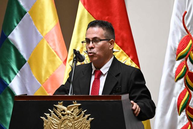 Jose Armando Urioste speaks during a ceremony recognizing his appointment as Bolivia's interim attorney general at the Government Palace in La Paz on October 5, 2026. The Bolivian Congress suspended the attorney general, who was detained after being accused by the United States of alleged links to drug trafficking, and appointed an interim replacement on October 3 following a lengthy emergency session. Roger Mariaca, who had headed the Public Prosecutor's Office from 2024 until his arrest on September 30, will be temporarily replaced by Jose Armando Urioste. (Photo by Aizar RALDES / AFP)