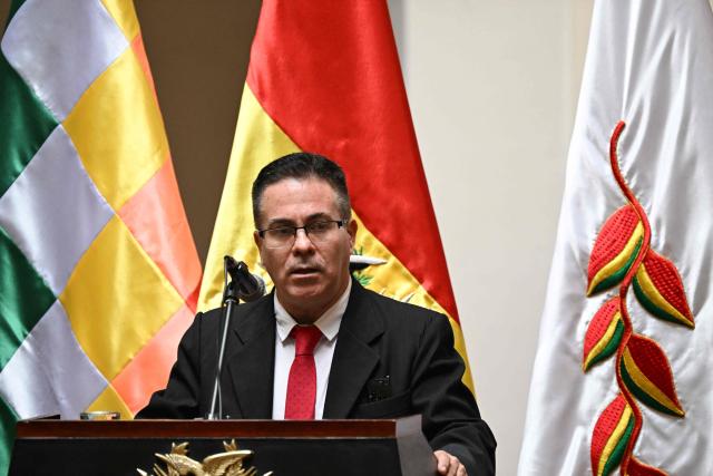 Jose Armando Urioste speaks during a ceremony recognizing his appointment as Bolivia's interim attorney general at the Government Palace in La Paz on October 5, 2026. The Bolivian Congress suspended the attorney general, who was detained after being accused by the United States of alleged links to drug trafficking, and appointed an interim replacement on October 3 following a lengthy emergency session. Roger Mariaca, who had headed the Public Prosecutor's Office from 2024 until his arrest on September 30, will be temporarily replaced by Jose Armando Urioste. (Photo by Aizar RALDES / AFP)