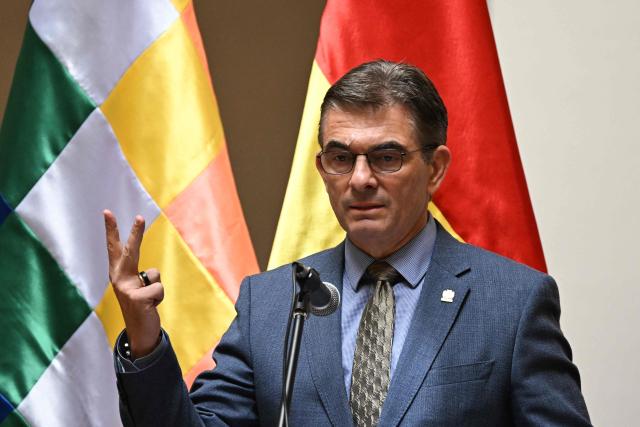 Bolivia's President Rodrigo Paz speaks during a ceremony recognizing Jose Armando Urioste as the country's interim attorney general at the Government Palace in La Paz on October 5, 2026. The Bolivian Congress suspended the attorney general, who was detained after being accused by the United States of alleged links to drug trafficking, and appointed an interim replacement on October 3 following a lengthy emergency session. Roger Mariaca, who had headed the Public Prosecutor's Office from 2024 until his arrest on September 30, will be temporarily replaced by Jose Armando Urioste. (Photo by Aizar RALDES / AFP)