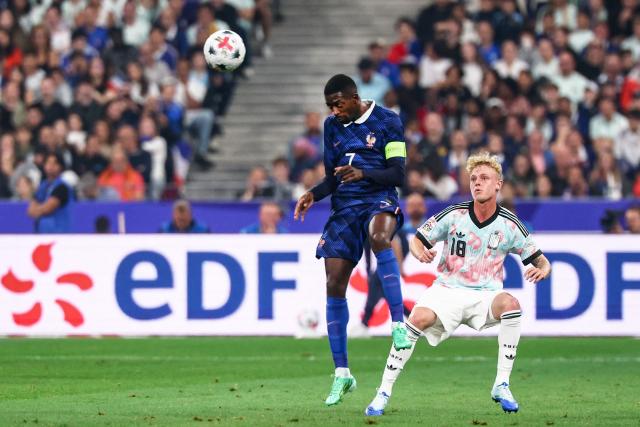 France's forward #07 Ousmane Dembele (L) fights for the ball with Belgium's midfielder #18 Joaquin Seys  during the UEFA Nations League Group A1 football match between France and Belgium at the Stade de France in Saint-Denis, north of Paris, on October 5, 2026. (Photo by FRANCK FIFE / AFP)