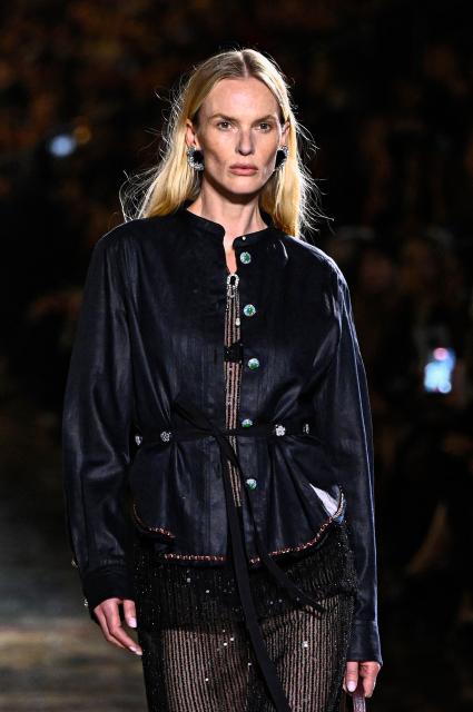 A model presents a creation for Chanel Women's Spring/Summer 2027 collection fashion show as part of the Paris Fashion Week, in Paris on October 5, 2026. (Photo by JULIEN DE ROSA / AFP)