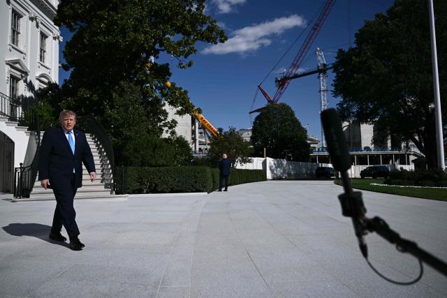 US President Donald Trump walks to speak to the press before departing from the South Lawn of the White House in Washington, DC, on October 5, 2026. Trump is travelling to Nebraska to speak at a campaign rally. (Photo by Brendan SMIALOWSKI / AFP)
