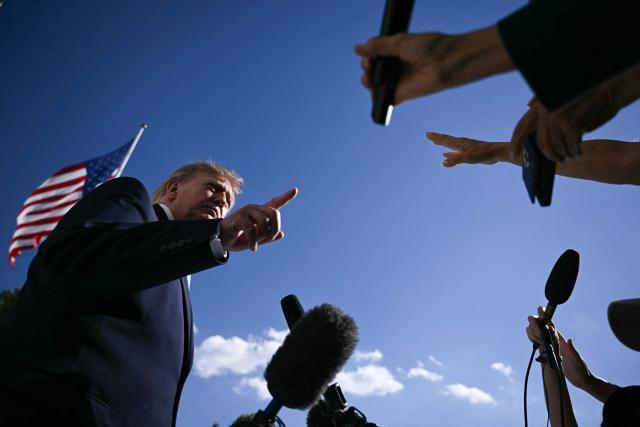 US President Donald Trump speaks to the press before departing from the South Lawn of the White House in Washington, DC, on October 5, 2026. Trump is travelling to Nebraska to speak at a campaign rally. (Photo by Brendan SMIALOWSKI / AFP)