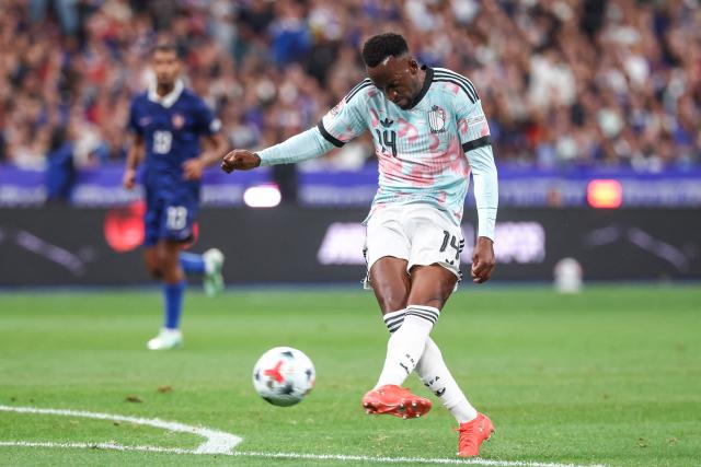 Belgium's forward #14 Dodi Lukebakio shoots and scores the opening goal during the UEFA Nations League Group A1 football match between France and Belgium at the Stade de France in Saint-Denis, north of Paris, on October 5, 2026. (Photo by FRANCK FIFE / AFP)