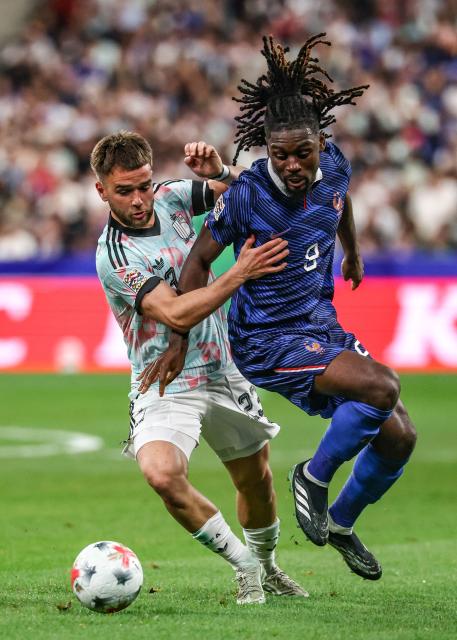 France's midfielder #08 Manu Kone (R) fights for the ball with Belgium's midfielder #23 Nicolas Raskin  during the UEFA Nations League Group A1 football match between France and Belgium at the Stade de France in Saint-Denis, north of Paris, on October 5, 2026. (Photo by FRANCK FIFE / AFP)