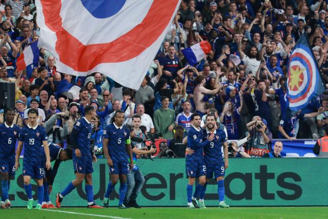 France's midfielder #09 Rayan Cherki celebrates with teammates scoring his team's second goal during the UEFA Nations League Group A1 football match between France and Belgium at the Stade de France in Saint-Denis, north of Paris, on October 5, 2026. (Photo by Kenzo TRIBOUILLARD / AFP)