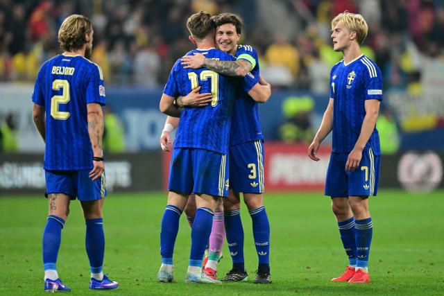 Sweden's players (from L) Sweden's defender #02 Felix Beijmo, Sweden's forward #17 Viktor Gyokeres, Sweden's defender #03 Victor Lindelof and Sweden's defender #04 Eric Smith celebrate after the UEFA Nations League Group B4 football match between Romania and Sweden in Bucharest on October 5, 2026. (Photo by Daniel MIHAILESCU / AFP)