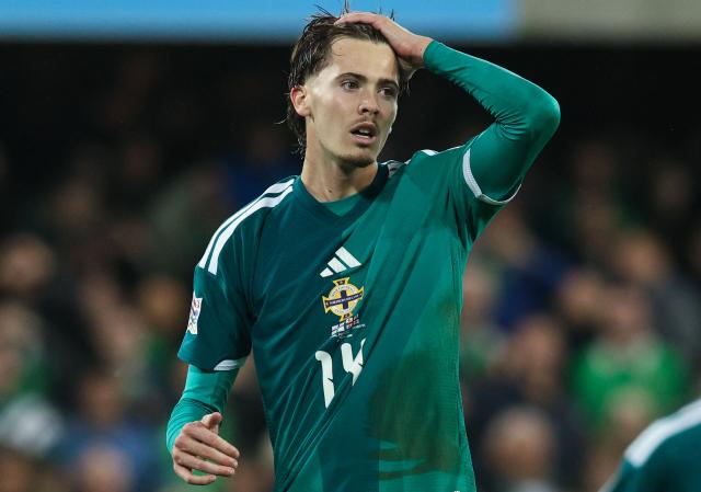 Northern Ireland's midfielder #14 Isaac Price reacts after his  penalty shot was saved during the UEFA Nations League, League B, Group 2 match between Northern Ireland and Georgia at Windsor Park in Belfast, Northern Ireland on October 5, 2026. (Photo by Paul Faith / AFP)