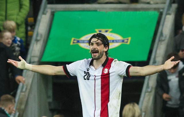 Georgia's defender #20 Saba Sazonov reacts at the final whistle during the UEFA Nations League, League B, Group 2 match between Northern Ireland and Georgia at Windsor Park in Belfast, Northern Ireland on October 5, 2026. (Photo by Paul Faith / AFP)