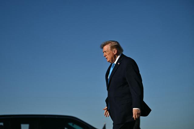 US President Donald Trump walks on the tarmac upon arrival at Central Nebraska Regional Airport in Grand Island, Nebraska, on October 5, 2026. (Photo by Kent NISHIMURA / AFP)