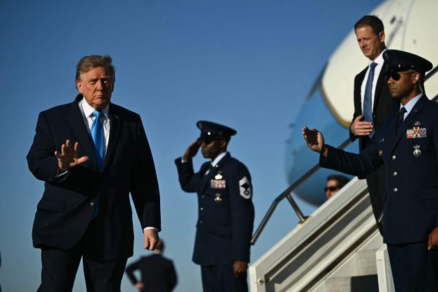 US President Donald Trump waves upon arrival at Central Nebraska Regional Airport in Grand Island, Nebraska, on October 5, 2026. (Photo by Kent NISHIMURA / AFP)
