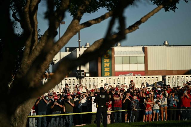 Supporters of US President Donald Trump wait to catch a glimpse of him as he arrives to speak during a campaign rally at Pinnacle Bank Expo Center in Grand Island, Nebraska, on October 5, 2026. (Photo by Kent NISHIMURA / AFP)