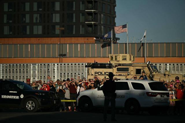Supporters of US President Donald Trump line up to catch a glimpse of him as he arrives to speak during a campaign rally at Pinnacle Bank Expo Center in Grand Island, Nebraska, on October 5, 2026. (Photo by Kent NISHIMURA / AFP)