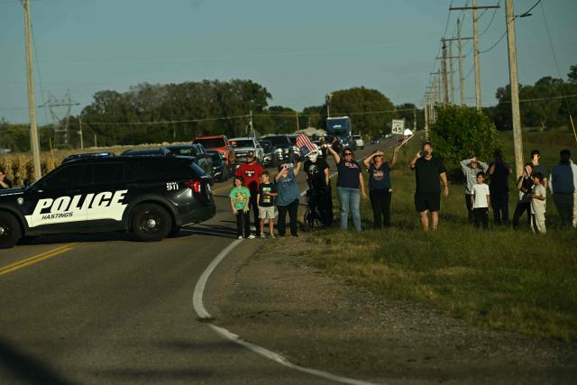 Supporters of US President Donald Trump line up to catch a glimpse of him as he arrives to speak during a campaign rally at Pinnacle Bank Expo Center in Grand Island, Nebraska, on October 5, 2026. (Photo by Kent NISHIMURA / AFP)