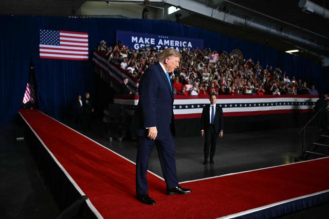 US President Donald Trump walks on stage to speak during a campaign rally at Pinnacle Bank Expo Center in Grand Island, Nebraska, on October 5, 2026. (Photo by Kent NISHIMURA / AFP)