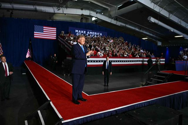 US President Donald Trump walks on stage to speak during a campaign rally at Pinnacle Bank Expo Center in Grand Island, Nebraska, on October 5, 2026. (Photo by Kent NISHIMURA / AFP)