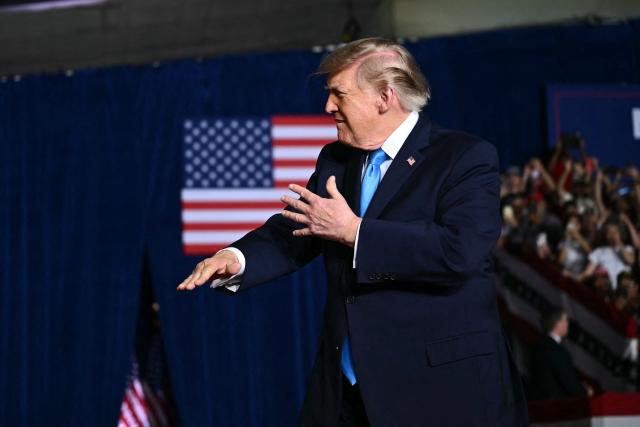US President Donald Trump gestures as he walks on stage to speak during a campaign rally at Pinnacle Bank Expo Center in Grand Island, Nebraska, on October 5, 2026. (Photo by Kent NISHIMURA / AFP)