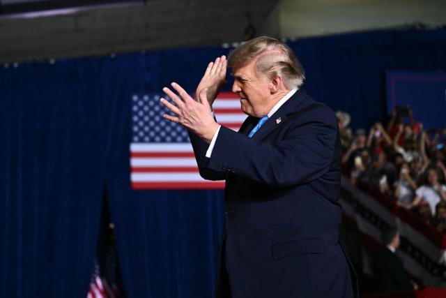 US President Donald Trump gestures as he walks on stage to speak during a campaign rally at Pinnacle Bank Expo Center in Grand Island, Nebraska, on October 5, 2026. (Photo by Kent NISHIMURA / AFP)