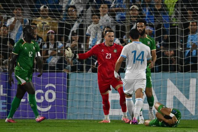 Suriname's goalkeeper #23 Etienne Vaessen and Guatemala's forward #14 Darwin Lom argue during the Concacaf Nations League Cup football match between Guatemala and Suriname at the Manuel Felipe Carrera stadium in Guatemala City on October 5, 2026. (Photo by Johan ORDONEZ / AFP)