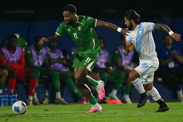 Suriname's forward #11 Denilho Cleonisse AND Guatemala's defender #16 Jose Morales fight for the ball during the Concacaf Nations League Cup football match between Guatemala and Suriname at the Manuel Felipe Carrera stadium in Guatemala City on October 5, 2026. (Photo by Johan ORDONEZ / AFP)