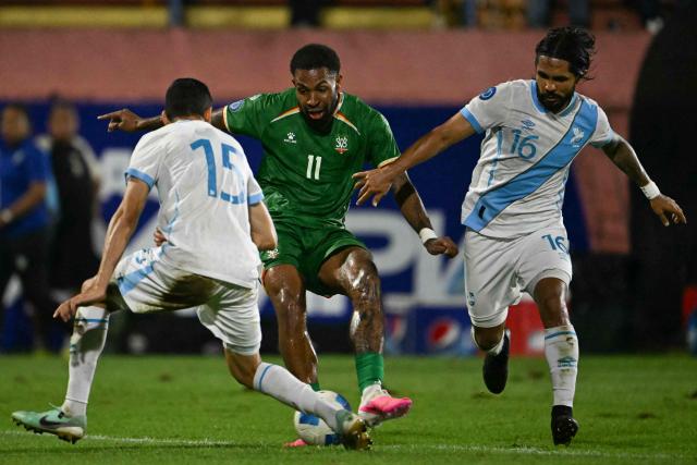 Suriname's forward #11 Denilho Cleonisse and Guatemala's defender #16 Jose Morales fight for the ball during the Concacaf Nations League Cup football match between Guatemala and Suriname at the Manuel Felipe Carrera stadium in Guatemala City on October 5, 2026. (Photo by Johan ORDONEZ / AFP)