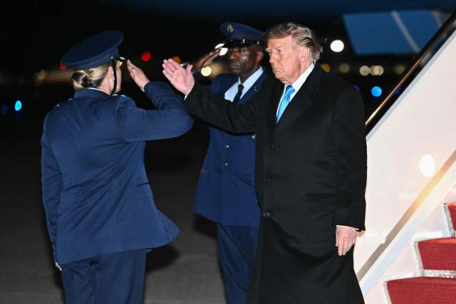 US President Donald Trump returns a salute upon disembarking from Air Force One at Joint Base Andrews, Maryland, on October 5, 2026. Trump is returning from Nebraska where he spoke at a campaign rally. (Photo by Kent NISHIMURA / AFP)