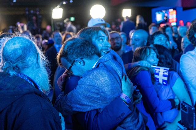 Supporters of Parti Quebecois (PQ) cheer as members of the party are elected in Montreal, Quebec, Canada, on October 5, 2026. (Photo by ANDREJ IVANOV / AFP)