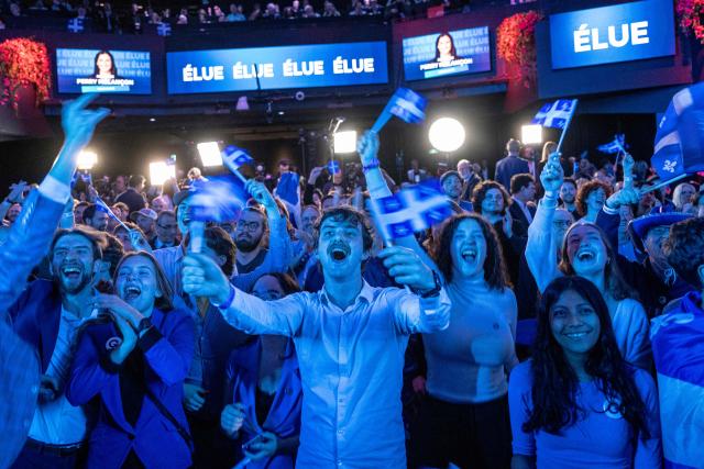 Supporters of Parti Quebecois (PQ) cheer as members of the party are elected in Montreal, Quebec, Canada, on October 5, 2026. (Photo by ANDREJ IVANOV / AFP)