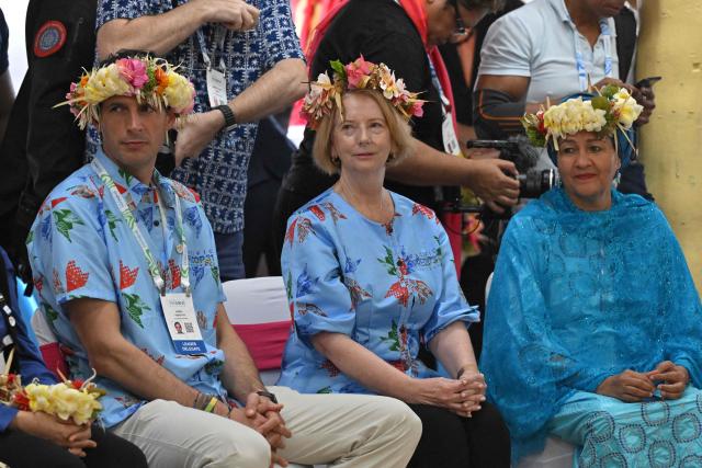 Australia's former prime minister Julia Gillard (C) attends a traditional welcome ceremony during the Pacific Pre-COP31 meeting in Tuvalu on October 6, 2026. (Photo by MICK TSIKAS / POOL / AFP)