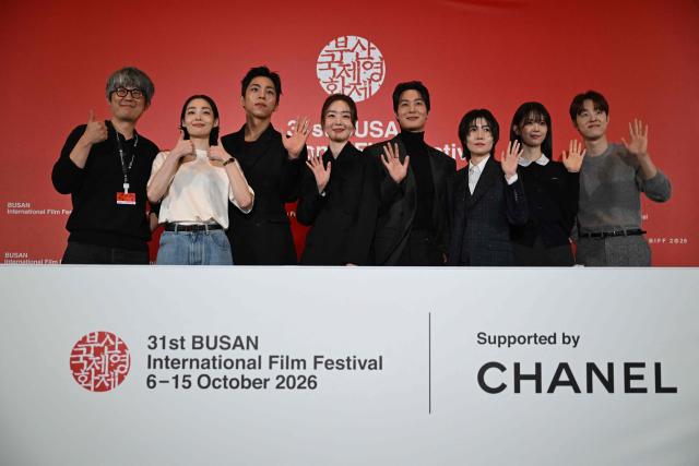 (L-R) South Korean Director Kim Jong-kwan and actors Kim Min-ha, Joo Jong-hyuk, Han Sun-hwa, Chang Ryul, Shim Eun-kyung, Jeon So-young, and Kim Dong-hwi pose for a photo during a press conference for the opening film "The Table: Day and Night" of the 31st Busan International Film Festival (BIFF) at the Busan Cinema Center in Busan on October 6, 2026. (Photo by Jung Yeon-je / AFP)