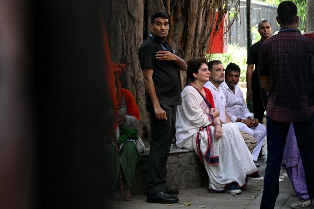 Indian National Congress (INC) party leaders Rahul Gandhi (C) and his sister Priyanka Gandhi Vadra (2L) look on during a protest march by the opposition alliance INDIA bloc (Indian National Developmental Inclusive Alliance) in New Delhi on October 6, 2026, against the country's Chief Election Commissioner Gyanesh Kumar calling for his resignation over alleged irregularities in the Special Intensive Revision (SIR) of electoral rolls. (Photo by Arun SANKAR / AFP)