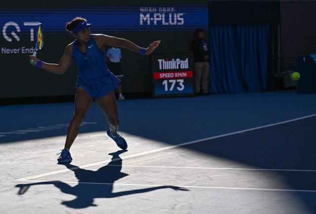 Japan’s Naomi Osaka hits a return to Czech Republic’s Karolina Muchova during their women’s singles match at the China Open tennis tournament in Beijing on October 6, 2026. (Photo by ADEK BERRY / AFP)