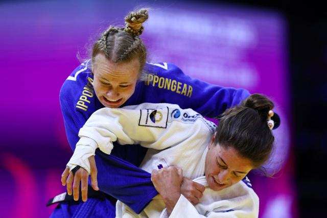 Israel's Timna Nelson Levy (white) competes against Finland's Pihla Salonen in the women's under 57 kg round of 32 at the World Judo Championships in Baku on October 6, 2026. (Photo by Anne-Christine POUJOULAT / AFP)
