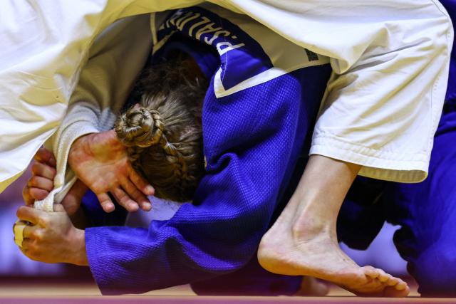 Israel's Timna Nelson Levy (white) competes against Finland's Pihla Salonen in the women's under 57 kg round of 32 at the World Judo Championships in Baku on October 6, 2026. (Photo by Anne-Christine POUJOULAT / AFP)