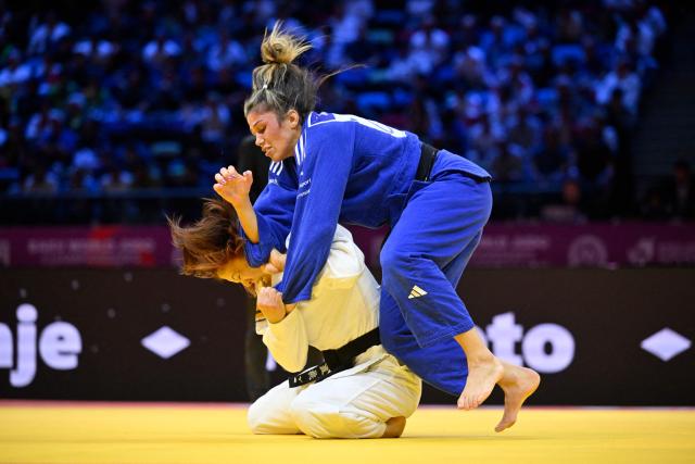 Japan's Momo Tamaoki (white) competes against Britain's Acelya Toprak in the women's under 57 kg round of 32 at the World Judo Championships in Baku on October 6, 2026. (Photo by Alexander NEMENOV / AFP)