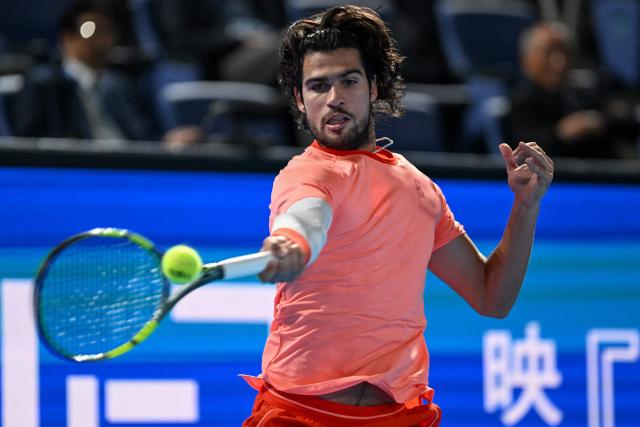 Spain's Carlos Alcaraz hits a return against Czech Republic's Jiri Lehecka in the men's singles final during the Japan Open tennis tournament at the Ariake Tennis Forest Park in Tokyo on October 6, 2026. (Photo by Rie KIKUCHI / AFP)
