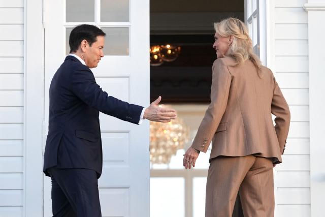 Iceland's Foreign Minister Thorgerdur Katrin Gunnarsdottir greets US Secretary of State Marco Rubio upon his arrival at Hofdi House as part of Rubio's European tour, in Reykjavik on October 6, 2026. US Secretary of State Marco Rubio starts in Iceland a three-nation European tour to push for greater US influence in the Arctic after Washington sealed a pact on Greenland. After Iceland, Rubio continues to Athens to participate in a "strategic dialogue" with NATO member Greece on regional and energy security before heading to Portugal. (Photo by Mark Schiefelbein / POOL / AFP)