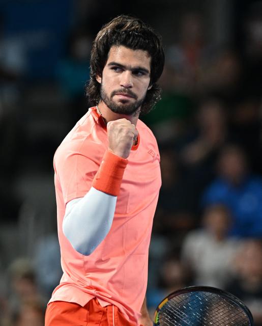 Spain's Carlos Alcaraz reacts after a point against Czech Republic's Jiri Lehecka in the men's singles final during the Japan Open tennis tournament at the Ariake Tennis Forest Park in Tokyo on October 6, 2026. (Photo by Rie KIKUCHI / AFP)