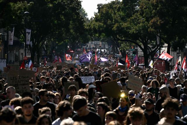 Protestors march along a street during a demonstration of high-school students as part of a nationwide protest movement over learning conditions in the south-western city of Bordeaux on October 6, 2026. Since late September, pupils have barred the entrances to hundreds of schools, complaining of teacher absences, overloaded timetables, dilapidated classrooms and buildings ill-adapted to rising temperatures, among other grievances. (Photo by Philippe LOPEZ / AFP)